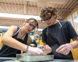 Two Calgary Academy students working in a science lab.