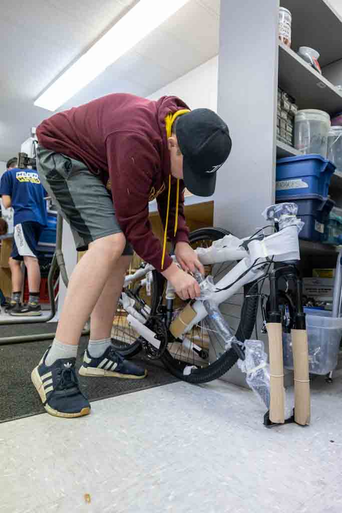 A Calgary Academy student removed the wrapping on a brand new bike in the school's Construction Lab. 