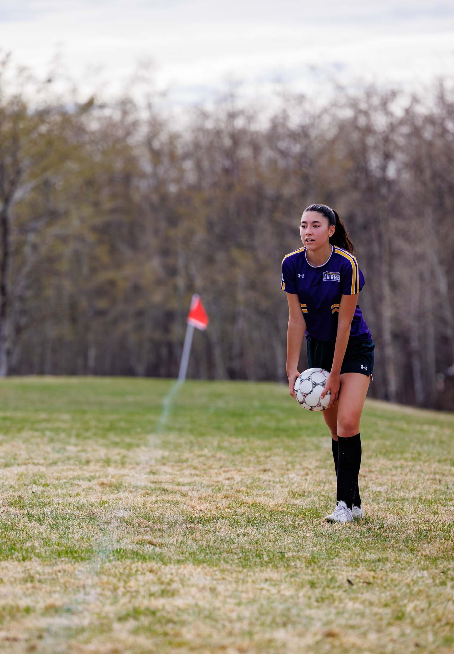 Calgary Academy student Olivia Y. throws the ball into play during a recent soccer game.