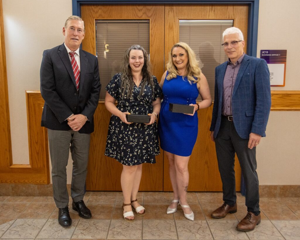 Ms. Page and Ms. McLim accepting Calgary Academy’s Board’s Exemplary Practice Award for June 2025, recognized for their outstanding contributions to student drama productions and performing arts education.