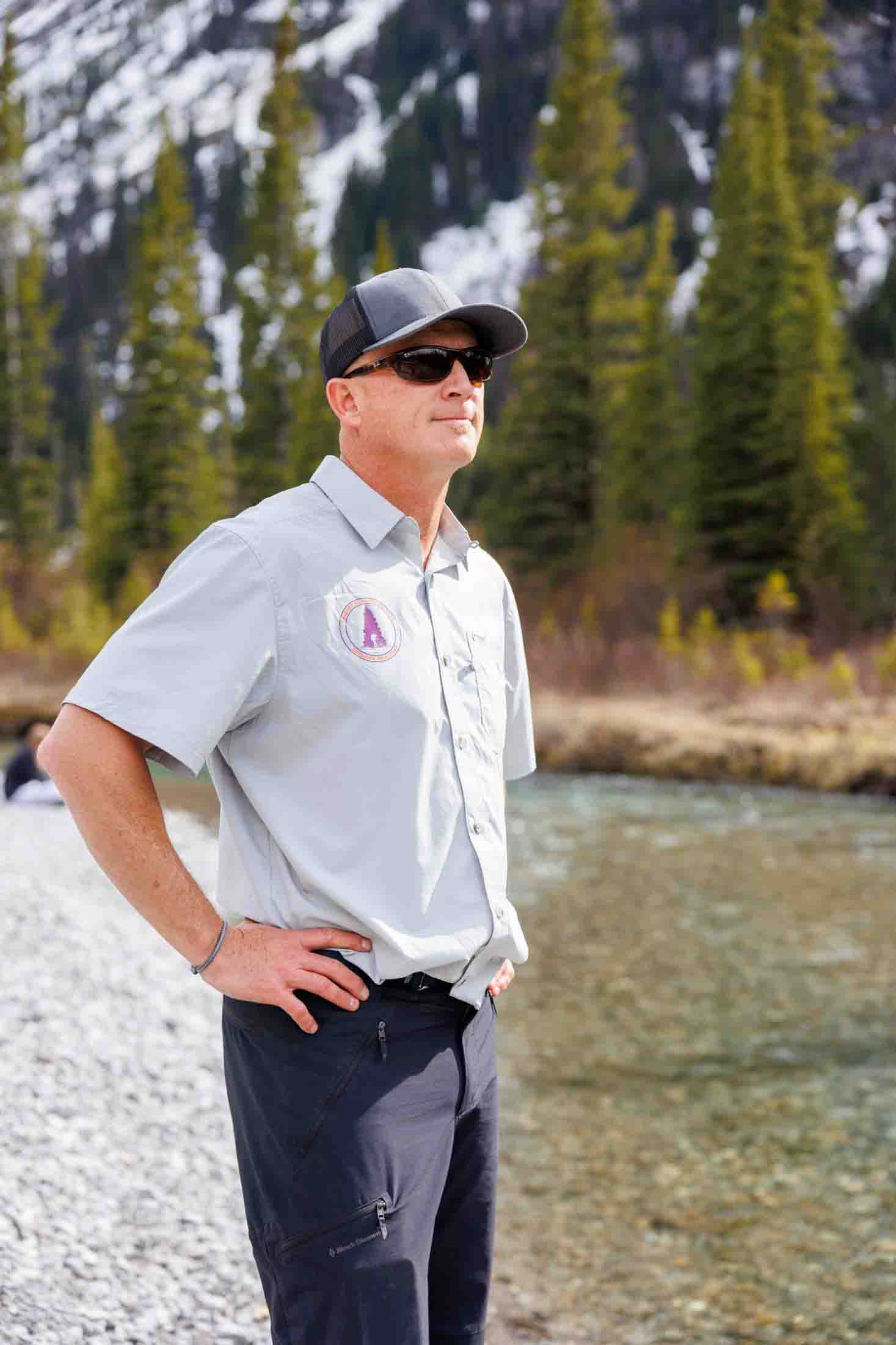 Jason Lindsay standing outside in the mountains